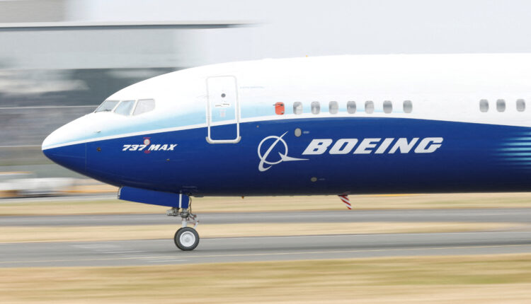 Boeing takes $2.8 bln hit in defense business, keeps cash flow goal